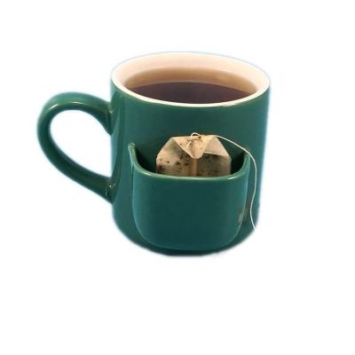 China Sustainable Green Glazed 13oz Ceramic Tea Mug With Tea Bag Holder for sale