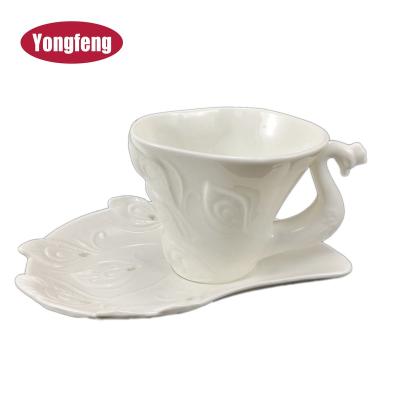 China Elegant Style Viable Novelty White Color Peacock Custom Embossed Ceramic Mugs With Dishes For Afternoon Tea for sale