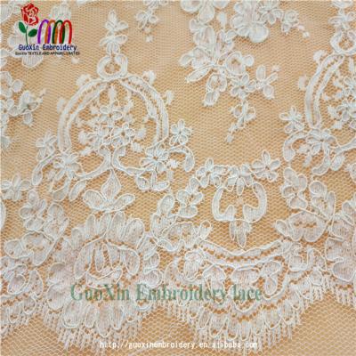 China 2022 Sustainable Matte Embroidery Lace Fabric Off White Bridal Lace With Tying for sale