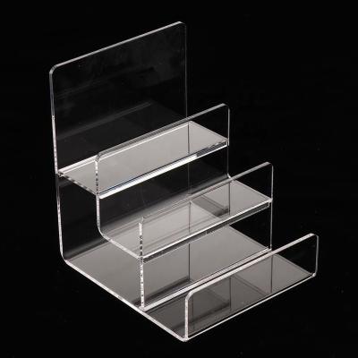 China Small Strong Acrylic Ladder Stage Women Purses Rack Acrylic Sunglasses Display Stand for sale