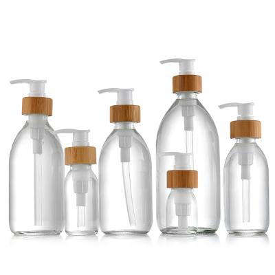 China Classic Hot Selling Glass Lotion Pump Bottles For Cosmetic Glass Pump Packaging for sale