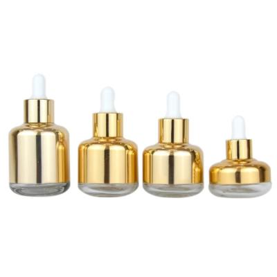 China The shinny cosmetic maker the serum glass gold cosmetic packaging bottle with dropper for sale