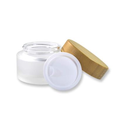 China Fashion 50ml Cosmetic Glass Cream Jar Frosted Wooden Printing Cosmetic Glass Container for sale