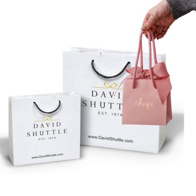 China Logo Design Luxury Paper Bag Recyclable Customized Gift Packaging Bag Shopping Paper Bag With Ribbon Handle for sale