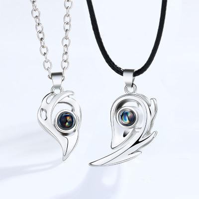 China Romantic couples necklace pairs of simple magnetic pendant chain heart-shaped clavicle men and women tongue suction100 I love you for sale