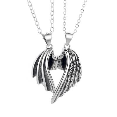 China Fashionable original angels and demons couples necklace anti-thai silver wings men's and women's pair pendant suction necklace one for sale