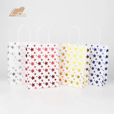 China Recycled Materials Gold Foil Star Gift Bag Handle Paper Bag Custom White Kraft Paper Bag for sale