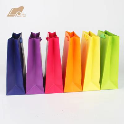 China Recycled Custom Logo Size Color Paper Materials Cheap Packaging Bag With Handle for sale