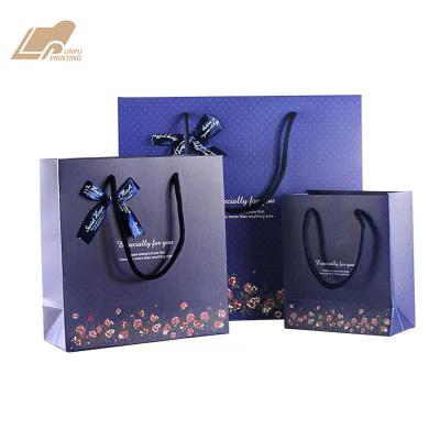 China Recycled Materials Hot Sales Style Dark Blue Bottom Dot Bag Custom Paper Gift Bags for sale