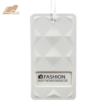 China Sustainable Embossing Custom Garment Logo Blank White Paper Hang Tag for sale