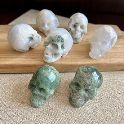 China China Quartz Crystal 2 Inch Crystal Moss Agate Skulls Crystal Skulls Cut Out for sale