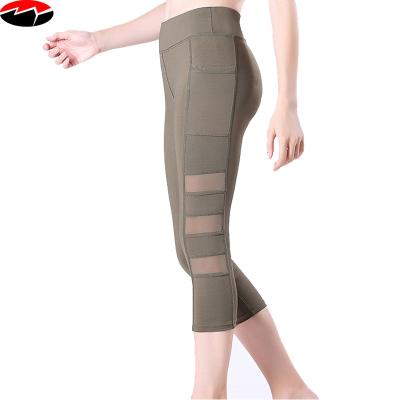 China Running Splice Mesh Capri Pants With Pockets Yoga Sports Fitness Buttock Lift Breathable High Rebound Motion for sale