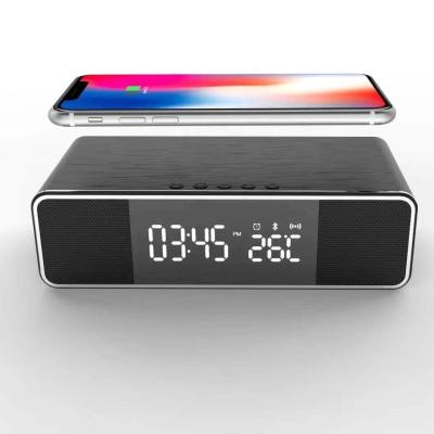 China Hot Selling Cell Phone Wireless Charging Alarm Clock Radio With Blue Tooth Speaker Radio for sale