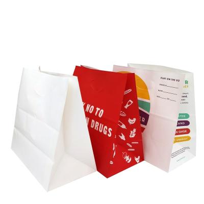 China Recyclable Economic Custom Design Supplier Die Cut Handle Kraft Customized Shopping Paper Bag With Handles for sale