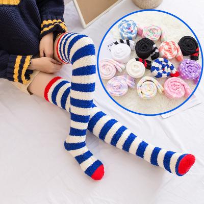 China Indoor Warm Breathable Long Sleeping Floor Above Knee Coral Fleece Fuzzy Socks Women Striped for sale