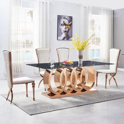 China Stable Luxury Home Furniture Stainless Steel Rectangle Tempered Glass Golden Dining Table for sale