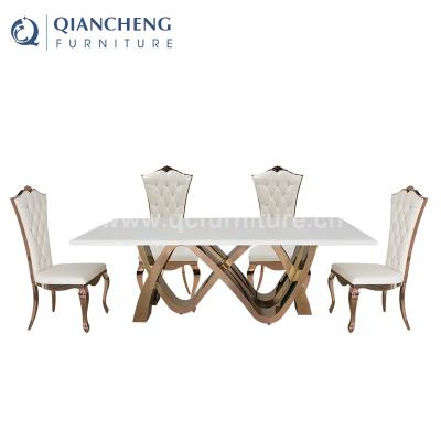 China STABLE gold marble top piece sets 8 seater dining stainless steel dining table set modern for sale