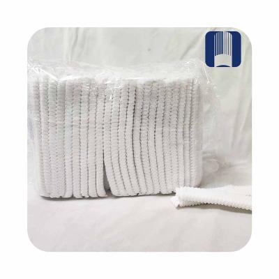 China Hot sale equestrian hair net hotel disposable disposable hair net 18 inch single rib nonwoven headwear for sale