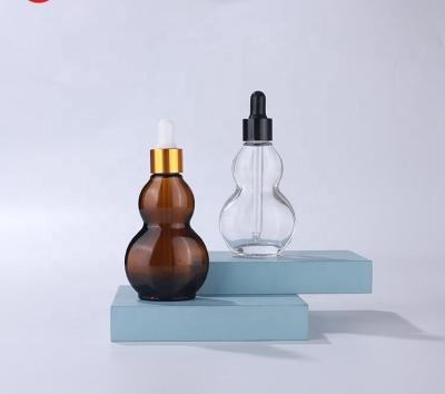 China Empty Amber Glass Bottle Double Gourd Flat Shaped Glass Dropper Serum Bottle 30ml for sale