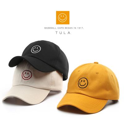 China COMMON Explosions smiling face female soft top embroidered cap Korean version of ins student casual hip hop couple cap men's curved bri for sale