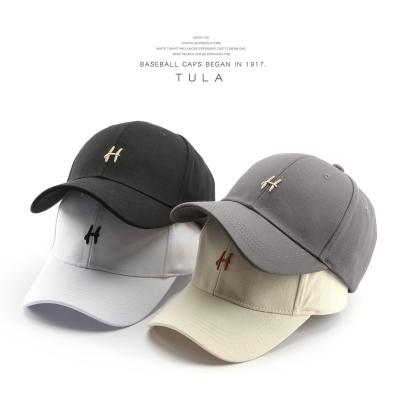 China COMMON Korean version of Japanese female H letter embroidered cap outdoor sports travel male sunscreen sunshade couple baseball hat for sale