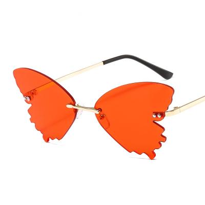 China Fashion Sunglasses New Arrivals Big Butterfly Shaped Sunglasses Metal Frame Rimless Shades Party Colored Sun Glasses for sale