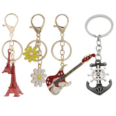 China Souvenir Gifts Promotion K2111 Eiffel Tower Car Student Daisy Guitar Couple Keychain Men Backpack Pendant Jewelry Key Chain Accessories for sale