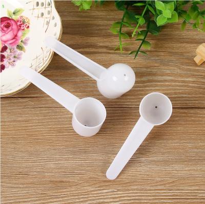 China 10g disposable perforated milk powder measuring spoon round bottom pp plastic measuring spoon factory direct sales for sale