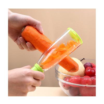 China 2021 Multifunctional Viable Stainless Steel Fruit Vegetable Peeler Carrot Grater Peeling Knife Kitchen Instruments Peeler With Container for sale