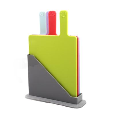 China Food Grade Hot Sale 4-Color Kitchen Tools Small Plastic Cutting Boards 4Pcs Set With Handle for sale