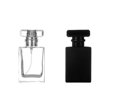 China Custom Logo Cosmetic Luxury Glass Perfume Bottle Black Clear Botol Parfum 30ml 50ml With Cap for sale