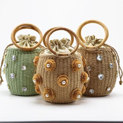 China Fashion Women Handbags Green Imitation Stone Balanced Basket Handbag Diamond Decoration Straw Braided Bucket Bag With Inner Drawstring for sale