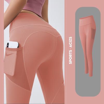 China Logo Woman Fitness Gym Custom Made Breathable Push Up Butt Lift Waist Yoga Gaiters Pants With Reticulated Mesh Pockets for sale