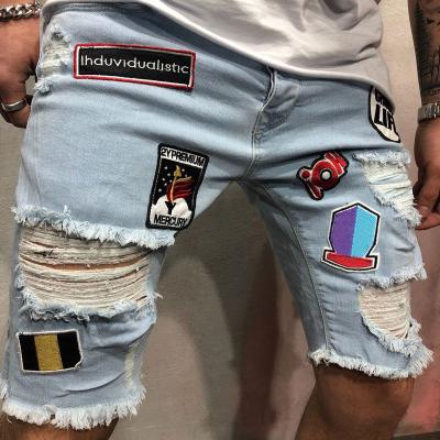 China Color New Fashion Fade Proof Summer 2021 Blue Color Patch Men Short Jeans New Ripped Badge Men Pants Embroidery Elastic Short Pants for sale