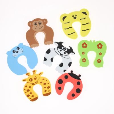 China Fridge Cardboard Style Baby Finger Protector Baby Door Stopper Clip for sale