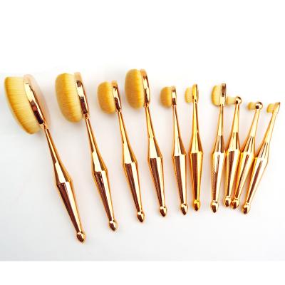 China Angular Blush 10pcs Rose Gold New Designed Tooth Shape Make Up Brush Universal Gold Oval Makeup Brush Kits Multi Function Cosmetic for sale