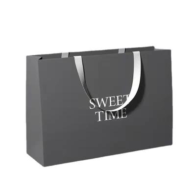 China Recyclable paper bag clothing shopping paper gift bag custom printing logo portable advertising custom for sale