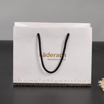 China Recyclable Customized Logo Luxury Boutique Shopping Tote Bag Customized Paper With Handle for sale