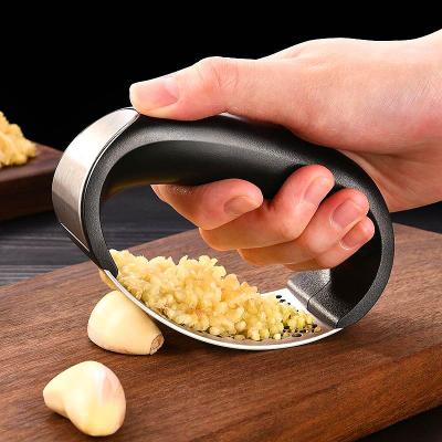 China Kitchen Accessories Instrument Stainless Steel Garlic Press Viable Manual Crusher For Household for sale