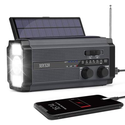 China PORTABLE Solar Panel Powered Battery Light Radio Hand-Cranked Torch Multi Function Solar Radio with Flashlight for sale