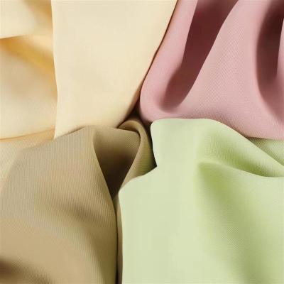 China Good Memory HuaZu Textile Wholesale 100% Polyester 2069# Elastic Dyed Woven Fabric Twill For Suits Suit WindCoat for sale