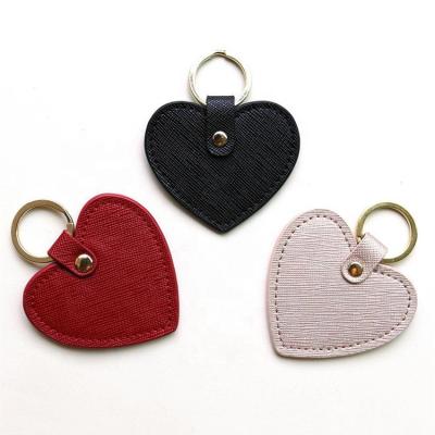 China Customized Environmentally Friendly Heart Shaped Europe Popular Car Logo Key Ring Saffiano PU Leather Key Chain for sale