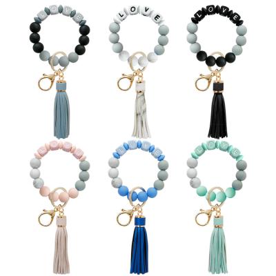 China Stylish Multicolor Matching Key Ring Bracelet, Love Letters Silicone Women Beaded Bracelet Key Chain Bracelet Leather Tassel for sale