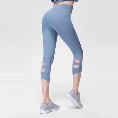 China Girl Breathable Summer Soft Feel Fabric Holes Design High Waist Skinny Fitness Capri Pants for sale