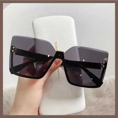 China Fashion Sunglasses 2023 Wholesale Low Price Rimless Cat Eye Designer Sunglasses Ladies New Sun Glasses For Women for sale