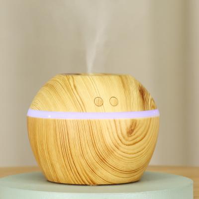 China Color Changing 300ml Grain Desktop Light LED Diffuser Essential Mini Ultrasonic Humidifier Portable Dark Wood Air Oil Cool Mist Aroma Diffuser for sale