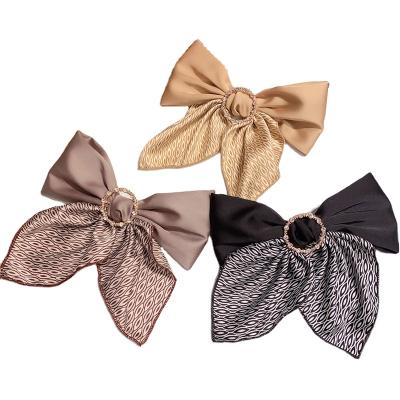 China Attractive premium large size crystal hair clips bow hair clips pearl butterfly hair barrettes for women for sale