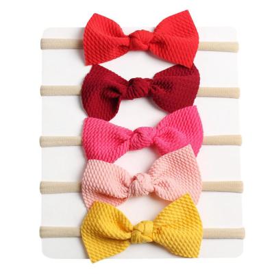 China Daily Hot Selling Nylon Elastic Hair Bands Solid Color Bowknot Girls Headbands Baby Hair Accessories For Kids Party Decoration for sale