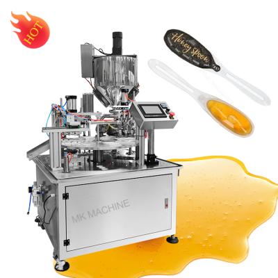 China New Type Automatic Honey Spoon Filling Machine Seal Pad Food Machine for sale