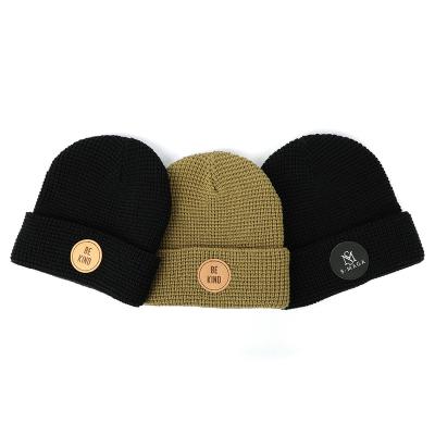 China 100% JOINT factory wholesale new style acrylic unisex winter hat, leather patch colorful dry fit skull knitted beanie for sale